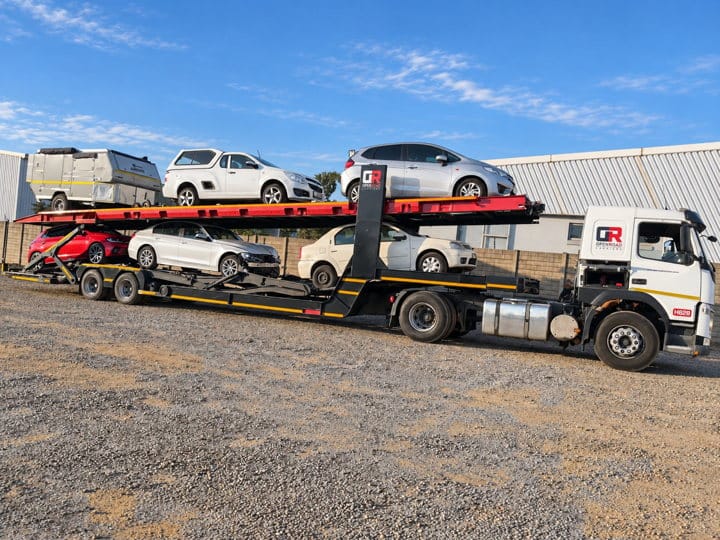 Open Road Carriers — vehicles on a transporter.