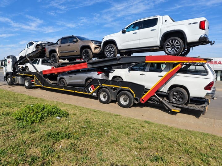 Open Road Carriers — pickup trucks on a carrier.