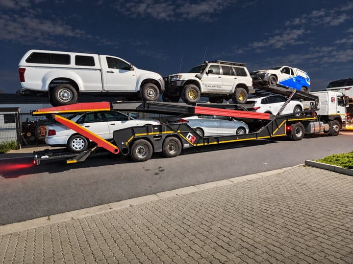 Open Road Carriers — SUVs at night.