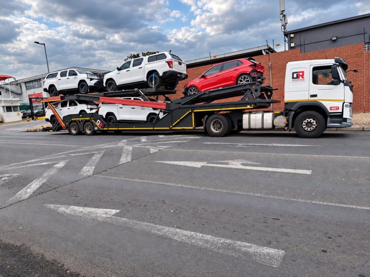 Open Road Carriers — vehicles on a transporter.