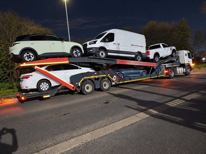 Open Road Carriers — a loaded carrier at night.