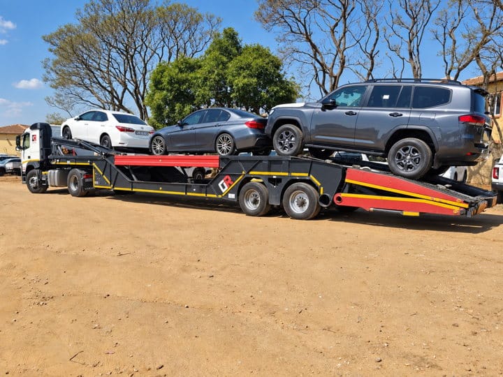Open Road Carriers — SUVs loaded for transport.