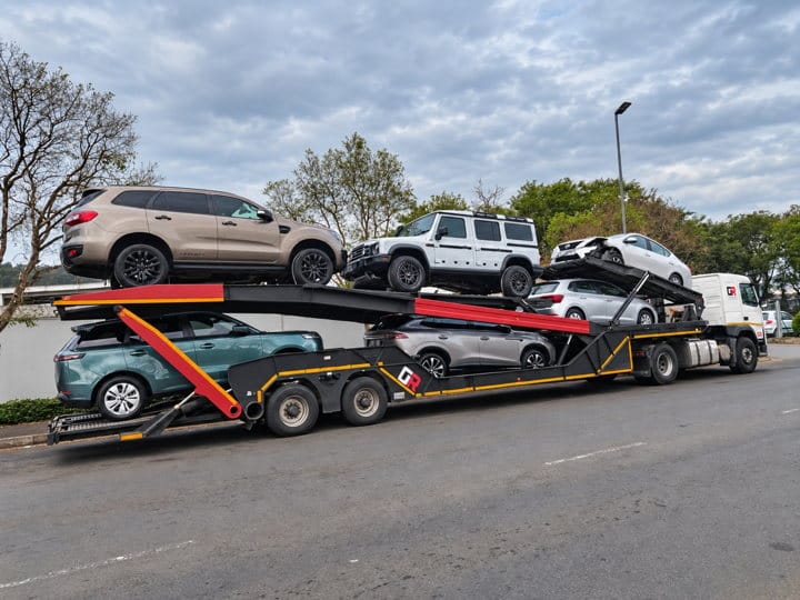 Open Road Carriers — SUVs on a carrier.