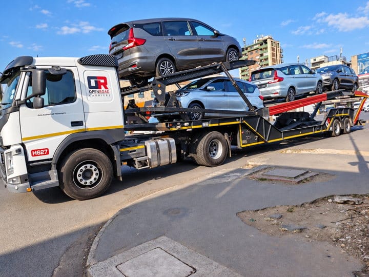 Open Road Carriers — cars on a transporter.