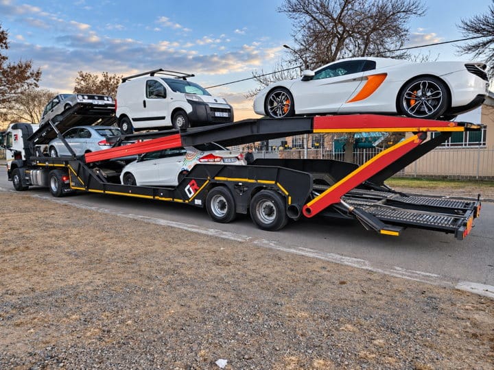 Open Road Carriers — cars on a transporter.