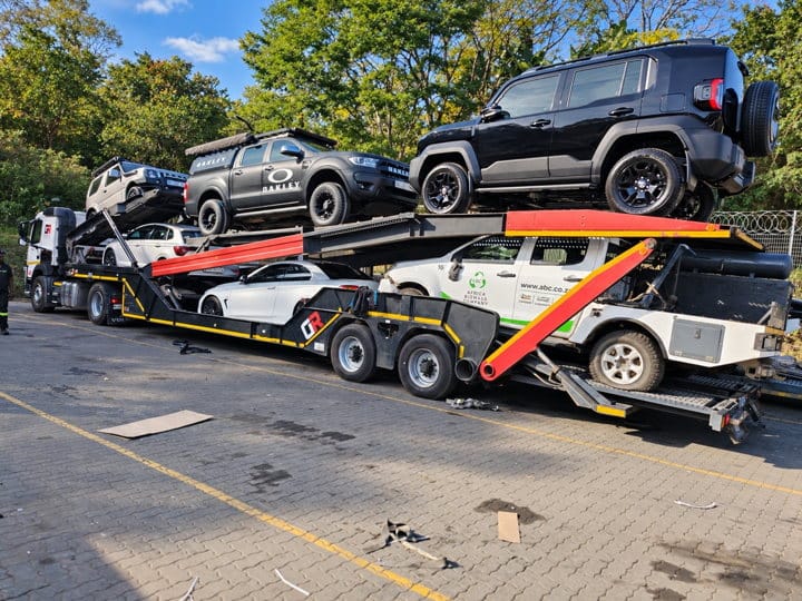 Open Road Carriers — SUVs loaded on a transporter.