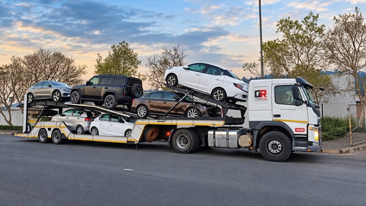Open Road Carriers — vehicles on a transporter.