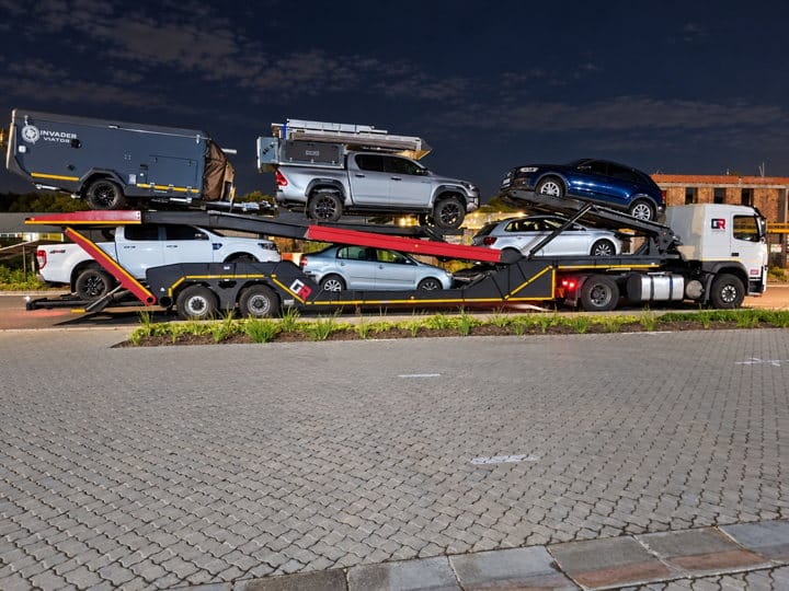 Open Road Carriers — vehicles loaded at night.