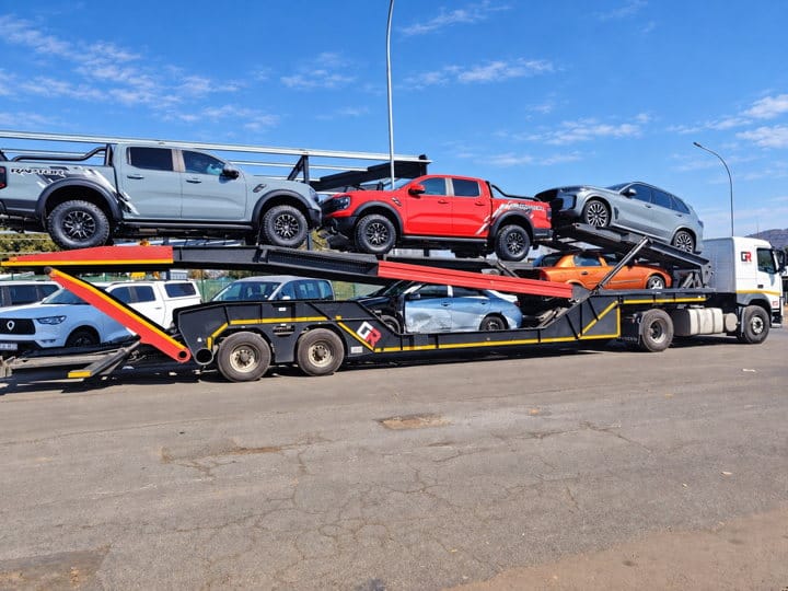 Open Road Carriers — vehicles on a transporter.