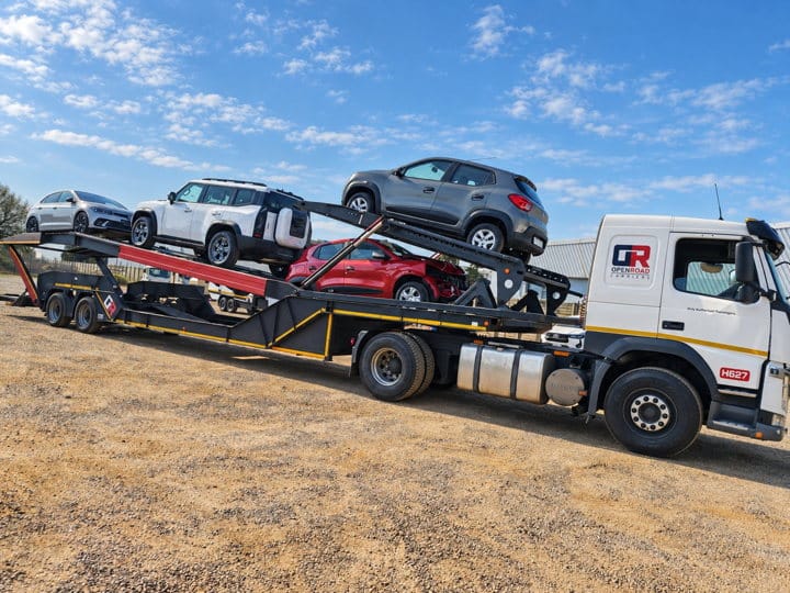 Open Road Carriers — vehicles loaded for transport.